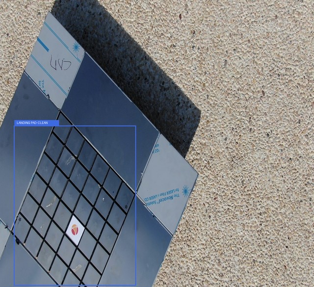 Illustrative clean KIOS frame with its source landing-pad annotation drawn in blue