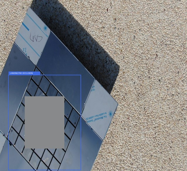 Illustrative occluded KIOS frame with its source landing-pad annotation drawn in blue